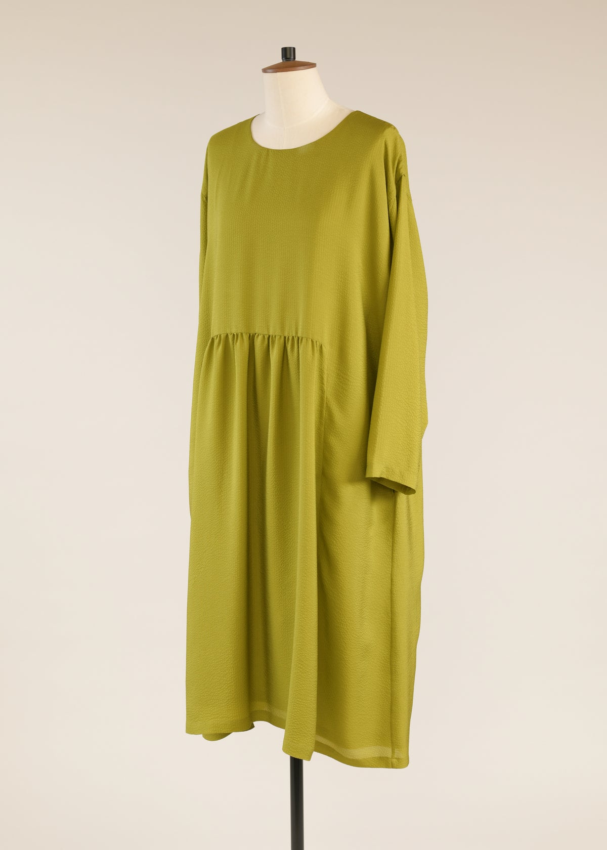 silk a-line round neck dress with 'pleated panels'