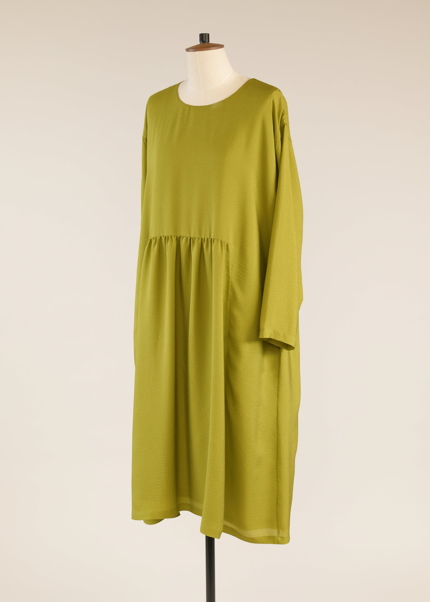 silk a-line round neck dress with 'pleated panels'