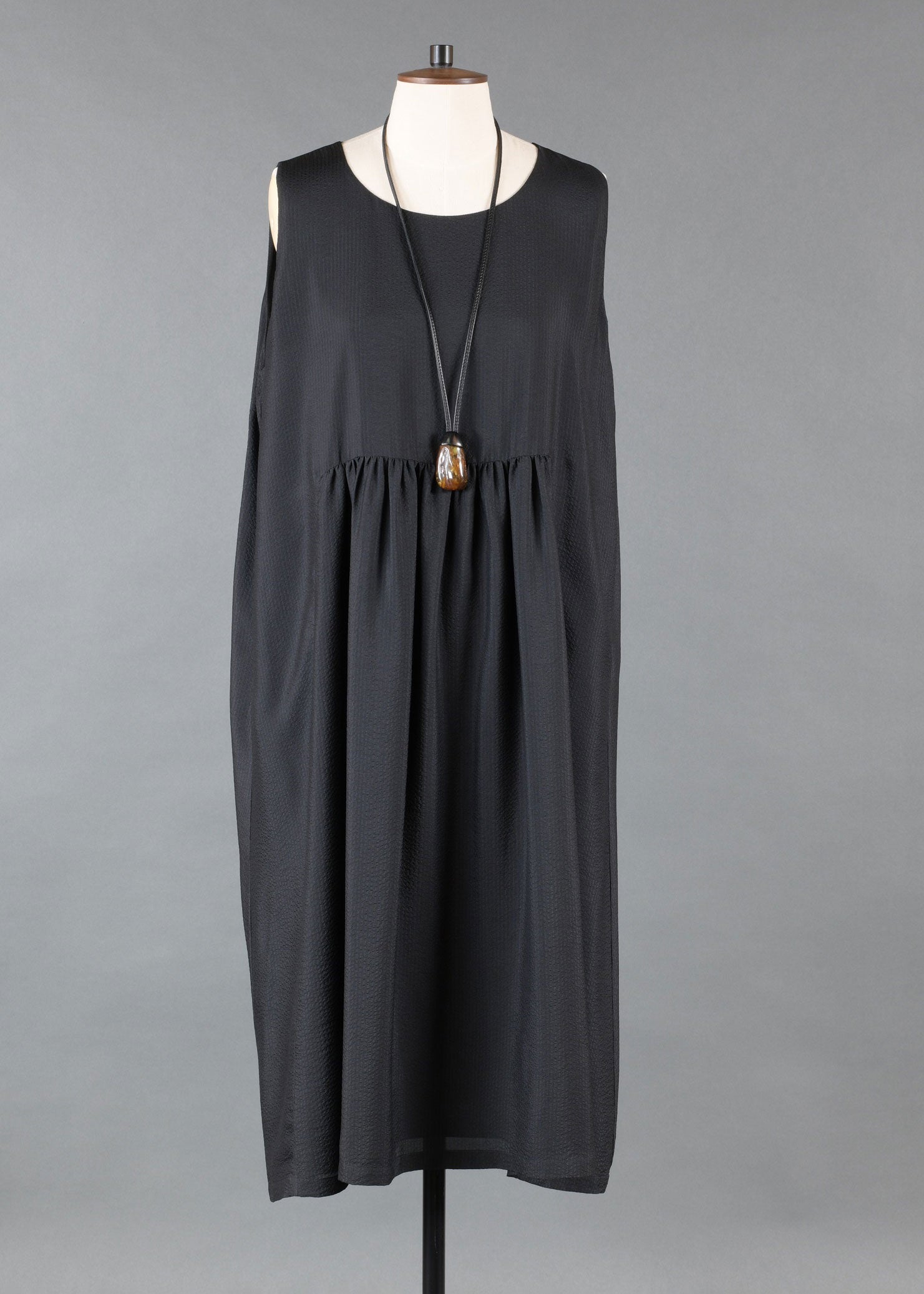 silk sleeveless round neck dress with 'pleated panels'