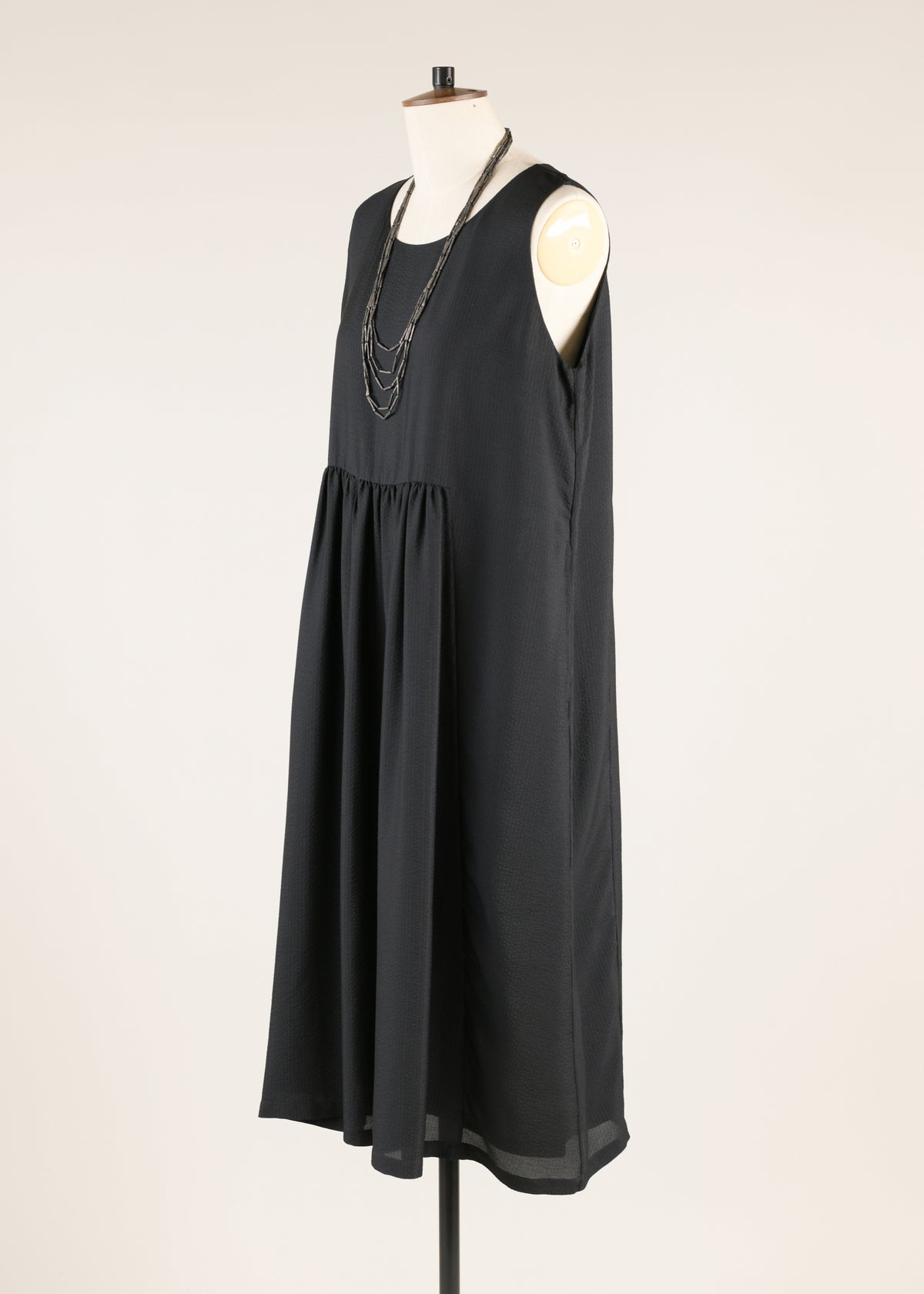 silk sleeveless round neck dress with 'pleated panels'