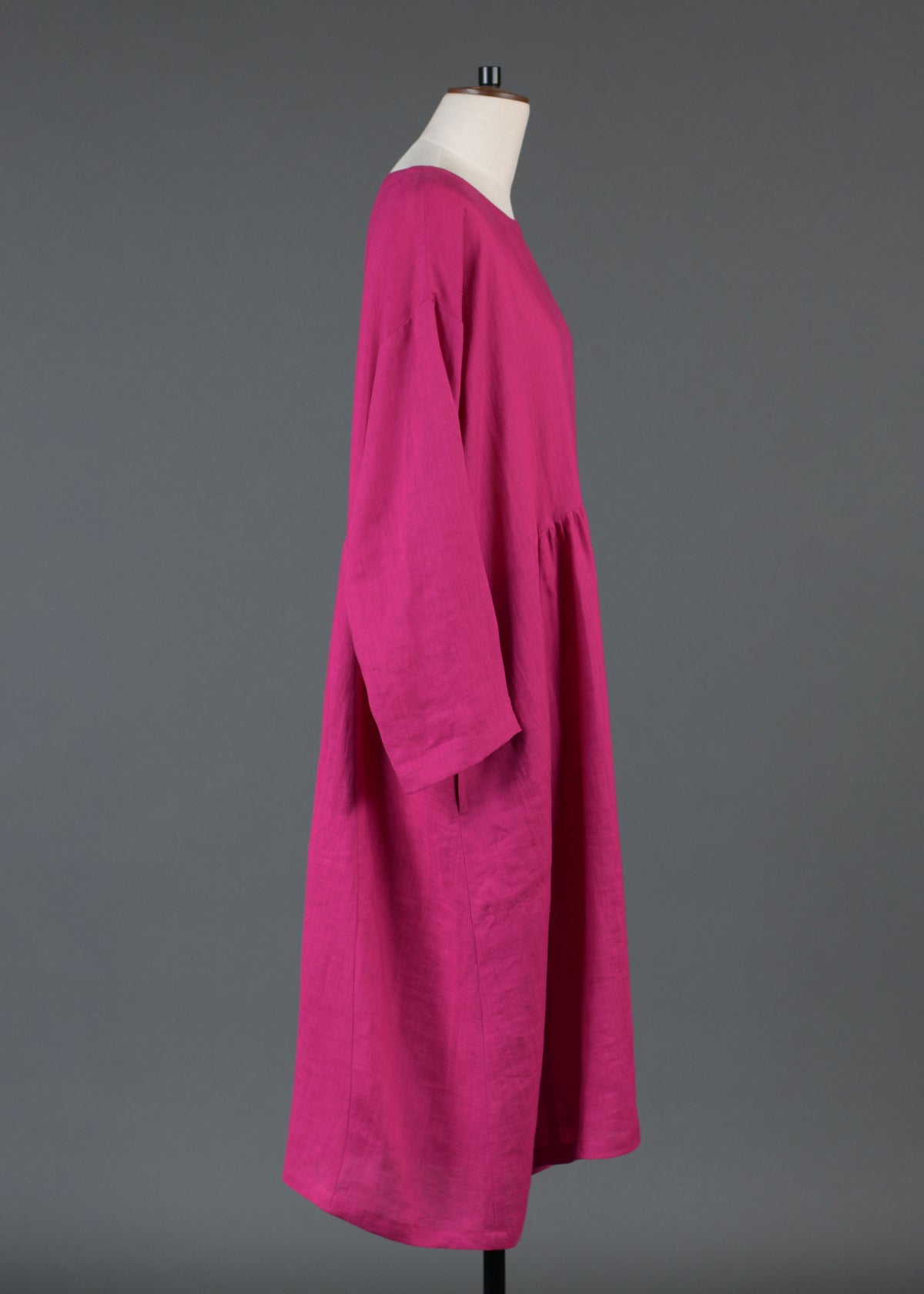 linen A-line round neck dress with pleated panels in lipstick
