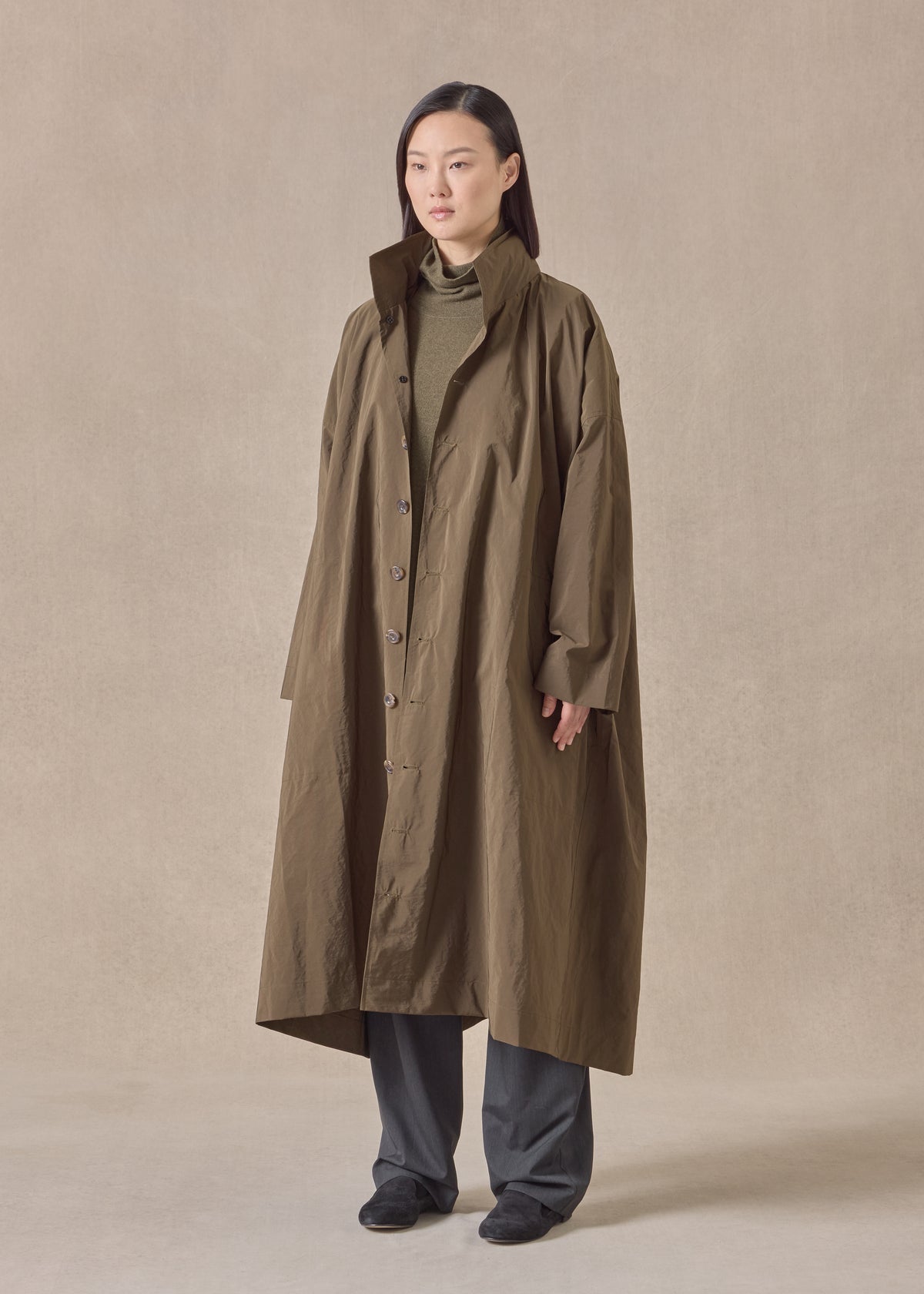 cotton mix smaller front larger back high neck raincoat with button away hood - full length
