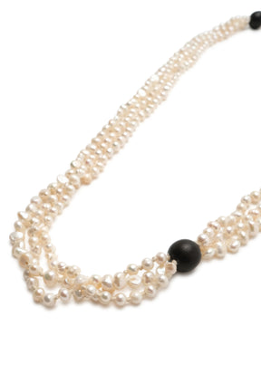 triple strand pearl necklace with wooden bead detail