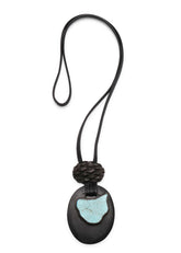 double oval kamag & stone leather pendant with carved pineapple