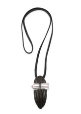 carved kamag oval pendant with rough crystal insert