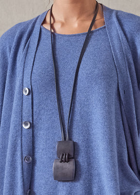 two piece 'stitched' wooden pendant