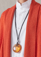 hand shaped coloured disc pendant (amber)