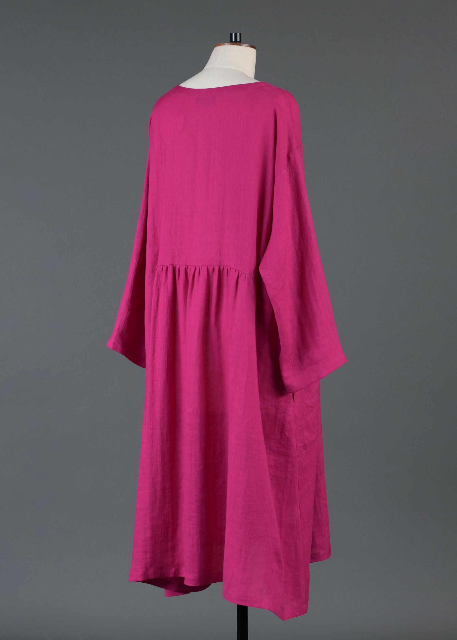 linen A-line round neck dress with pleated panels in lipstick