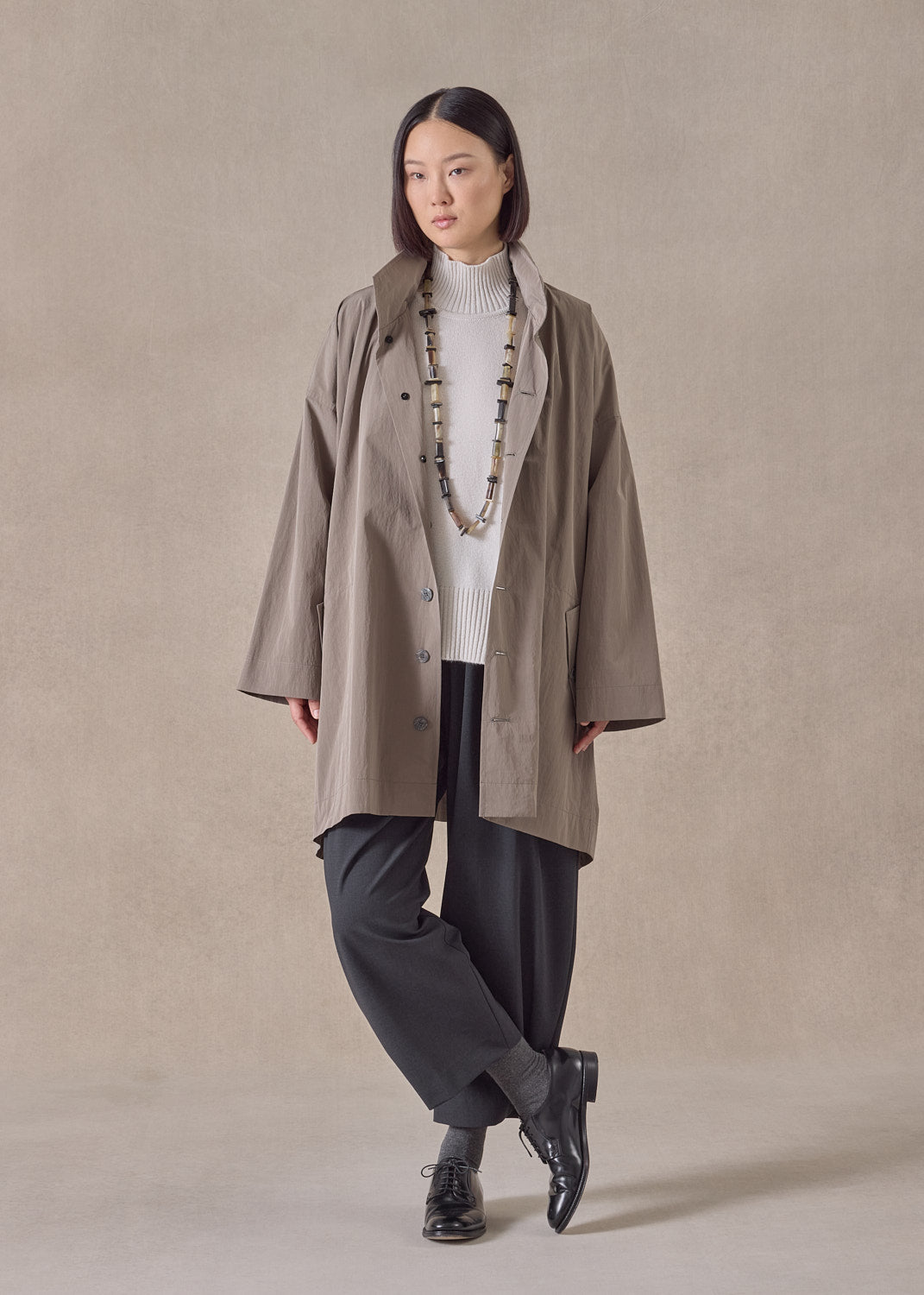 cotton mix smaller front larger back high neck raincoat with button away hood - long plus (stone)