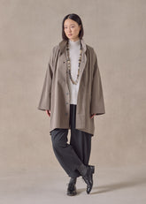 cotton mix smaller front larger back high neck raincoat with button away hood - long plus (stone)