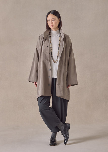 cotton mix smaller front larger back high neck raincoat with button aw