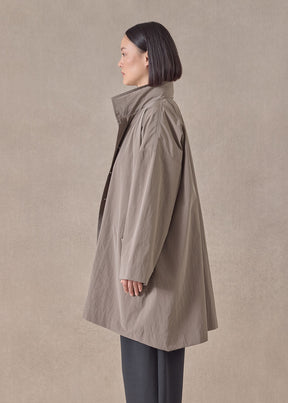 cotton mix smaller front larger back high neck raincoat with button away hood - long plus (stone)