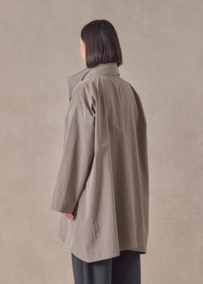 cotton mix smaller front larger back high neck raincoat with button away hood - long plus (stone)