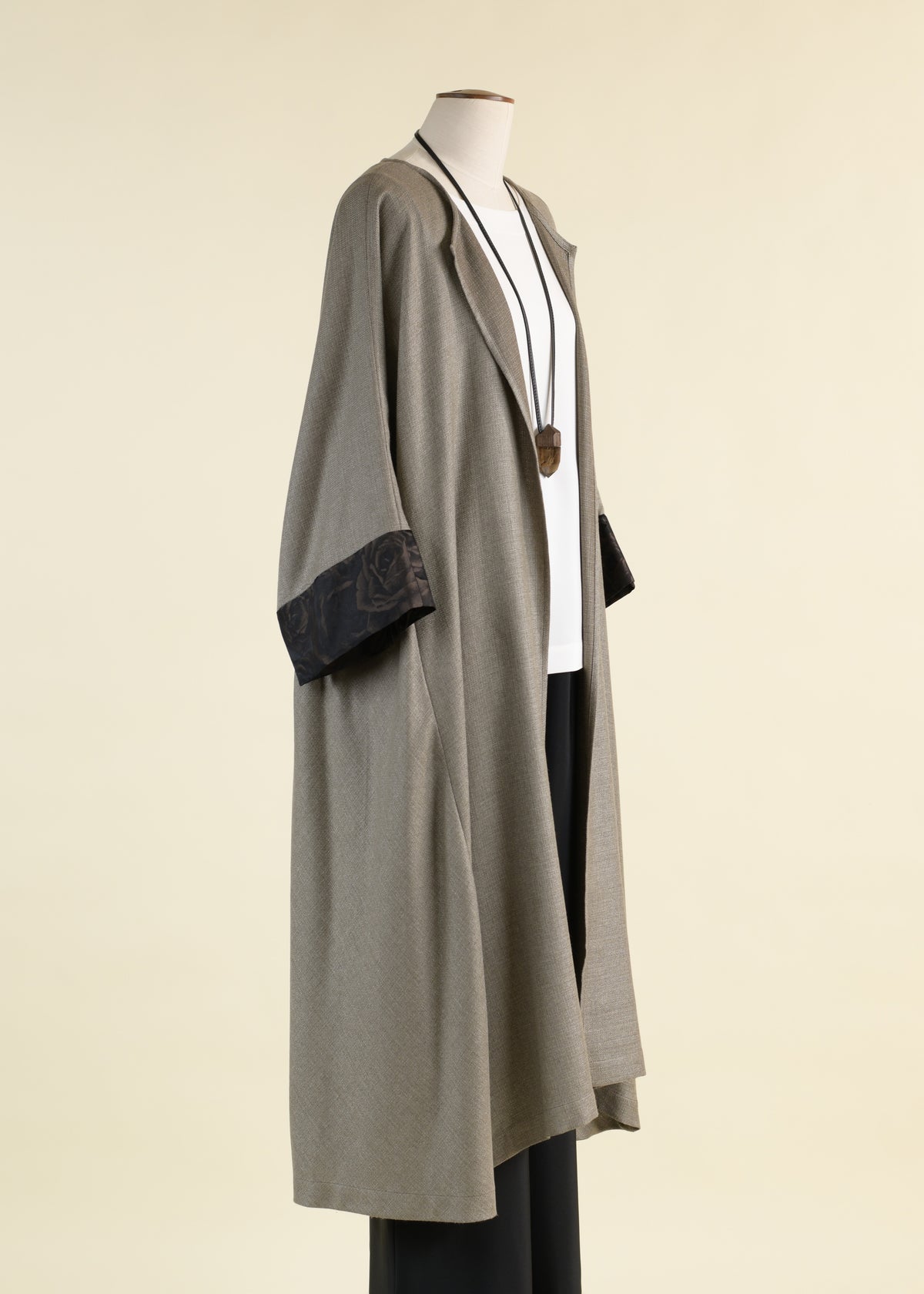 round neck coat with bias side panel and cuff detail
