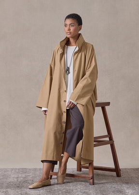 cotton mix smaller front larger back high neck raincoat with button away hood - full length (camel)