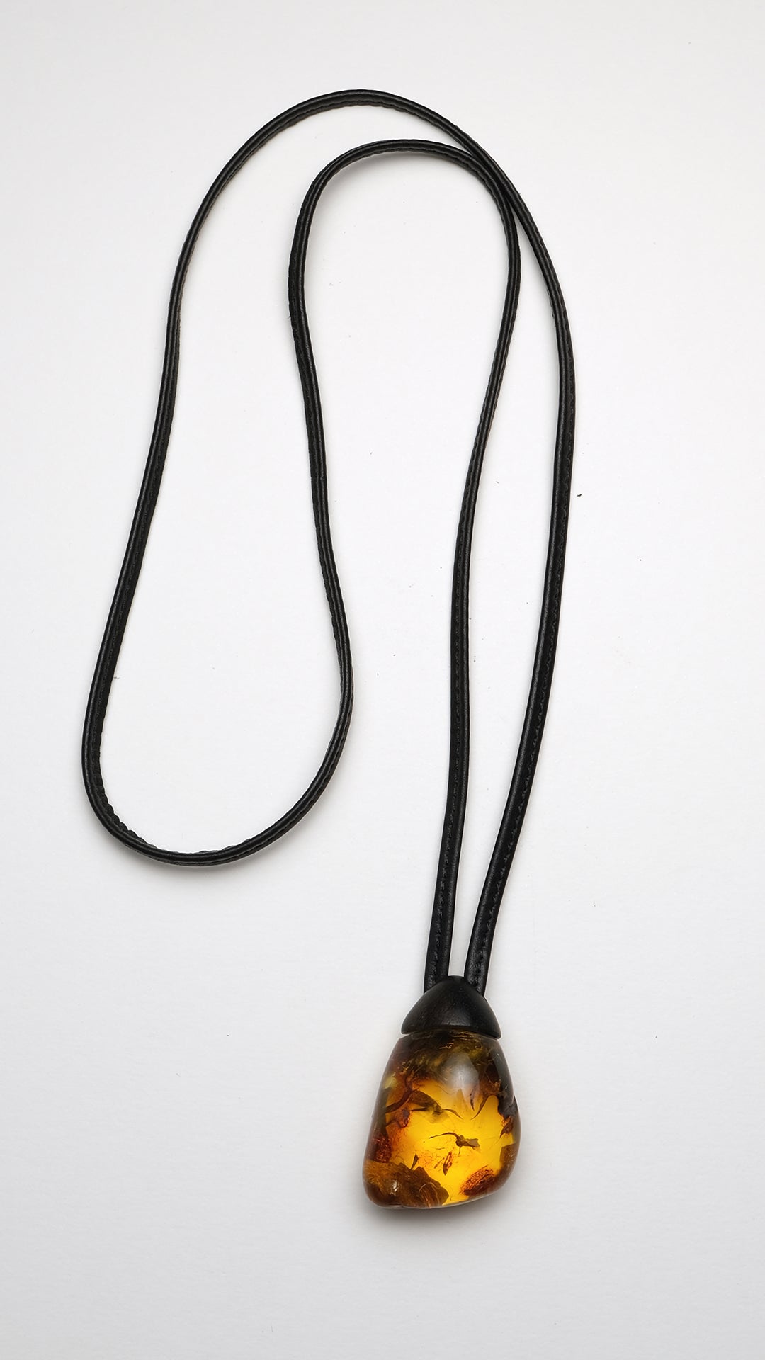 natural amber stone pendant with kamagong (monies)