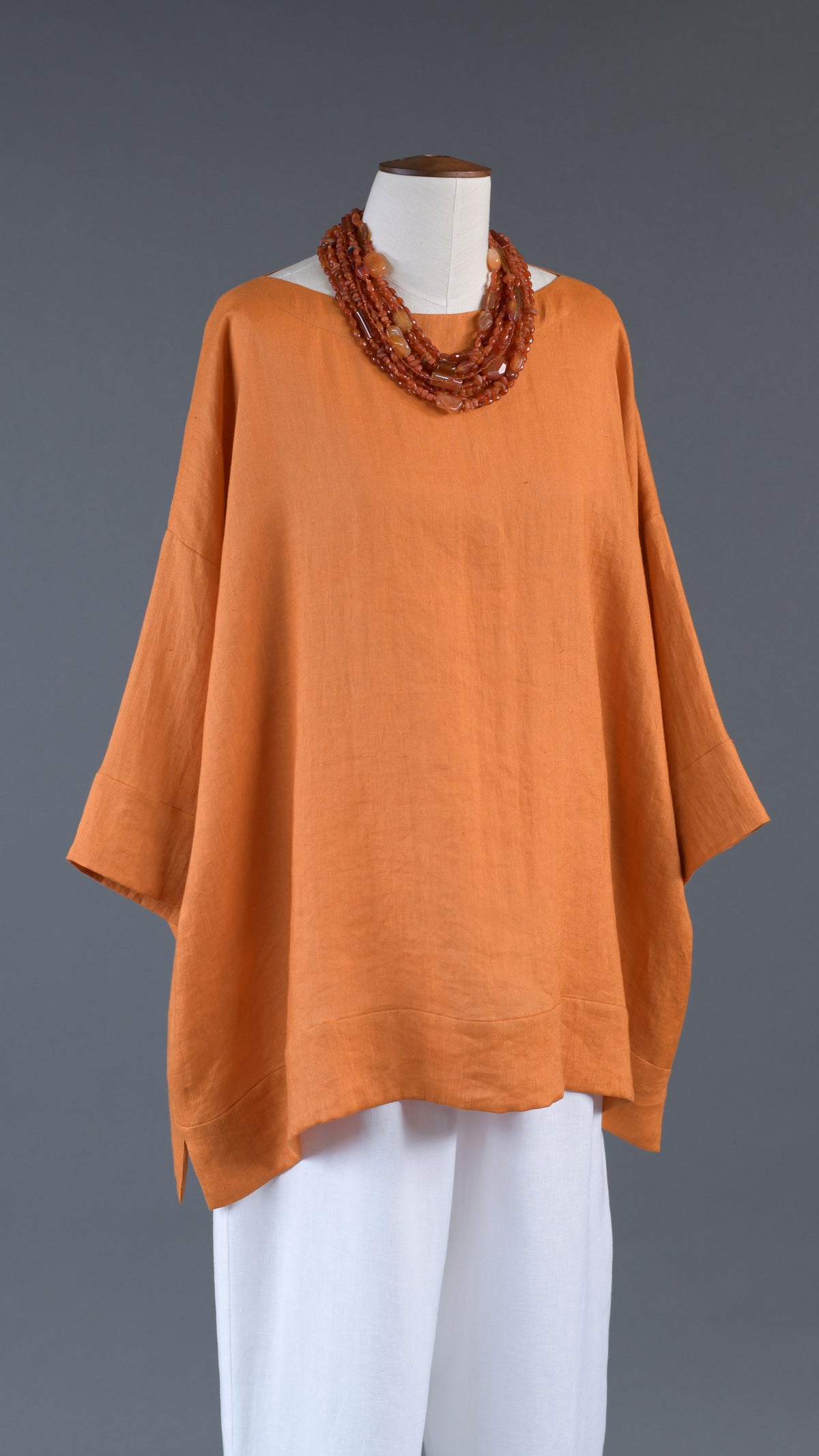 scoop neck 3/4 sleeve top with hem bands - long in amber orange