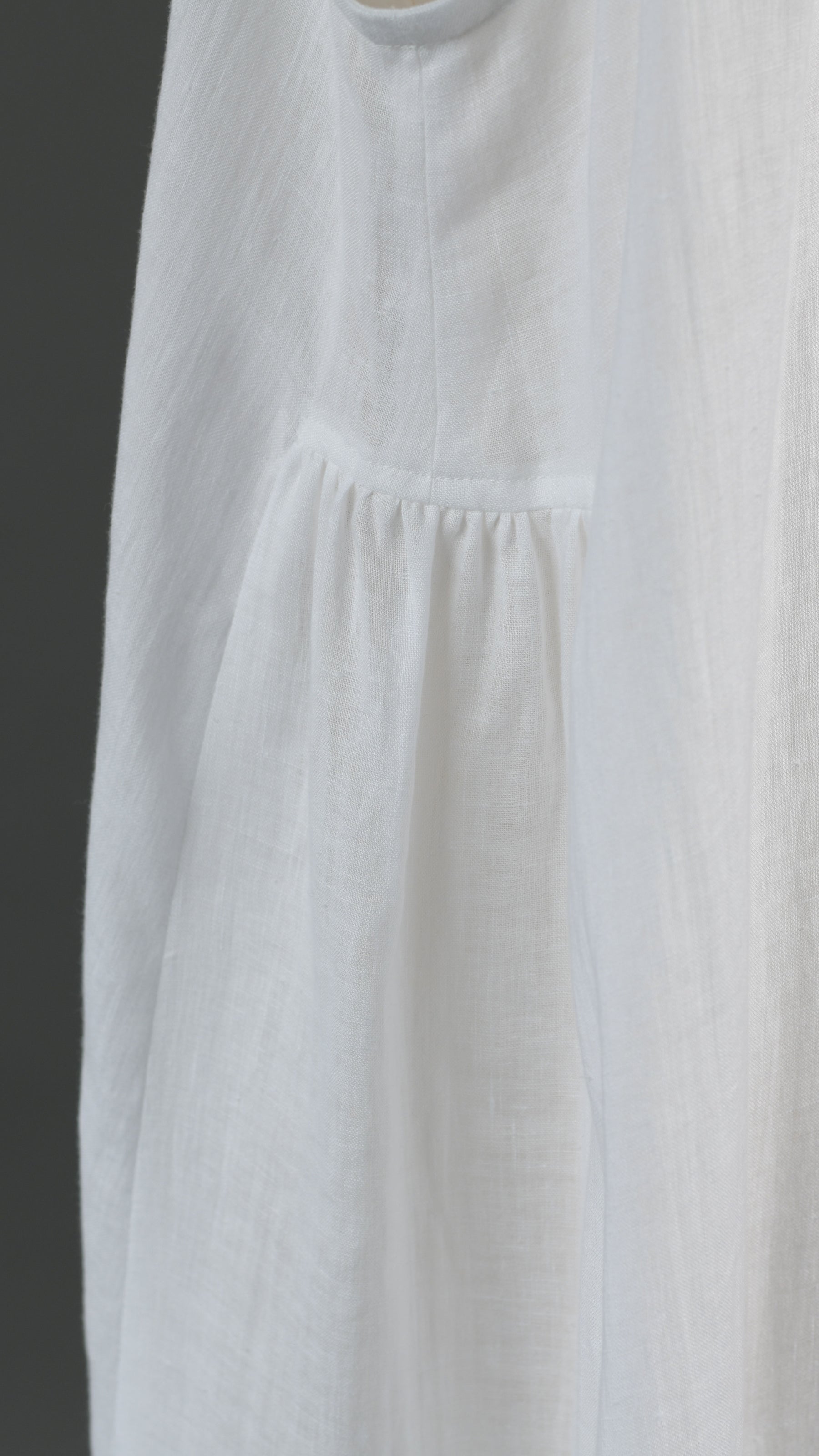 3/4 length side pleated sleeveless dress in white