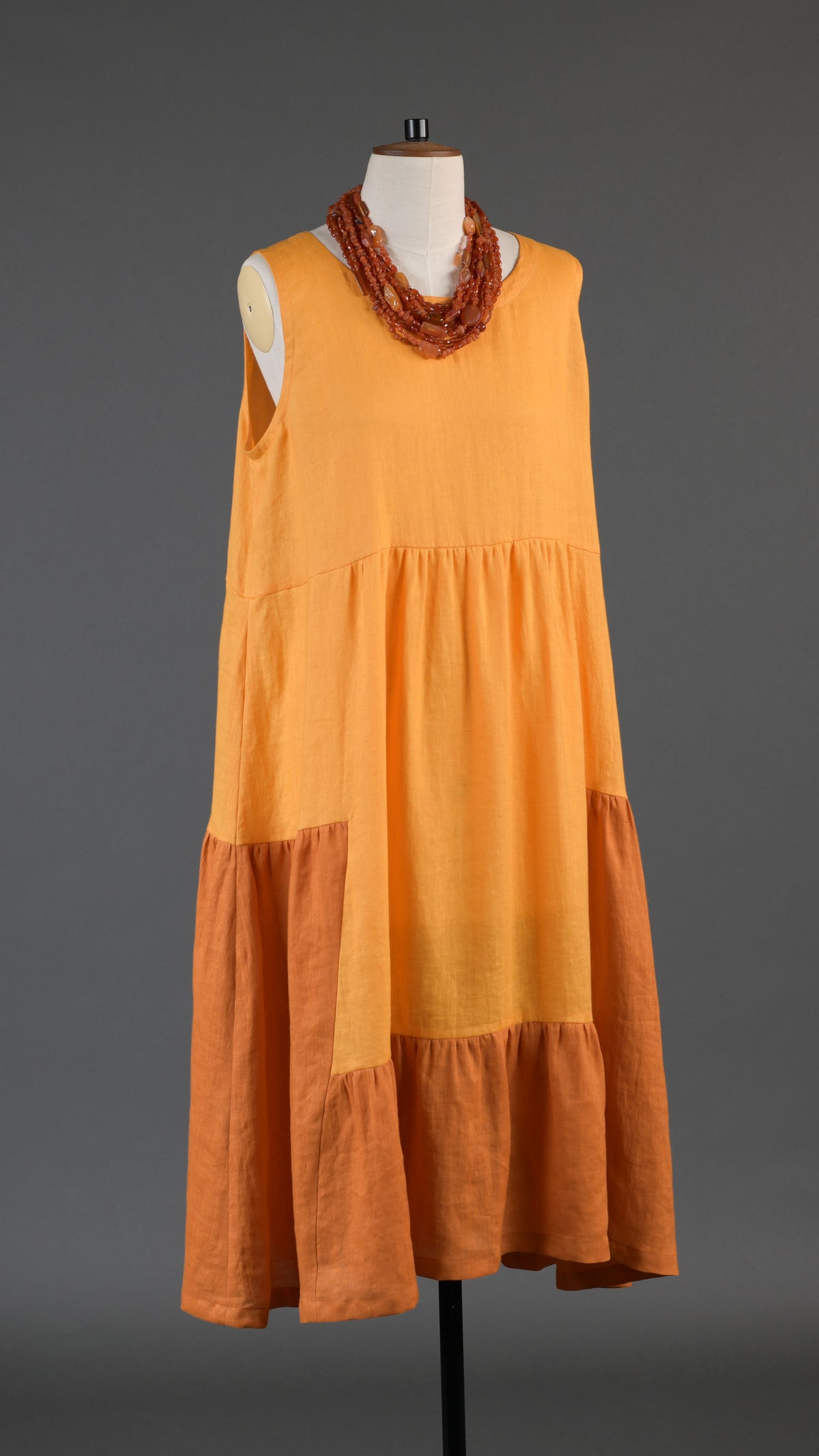 two tone tiered pleated sleeveless dress in orange mix