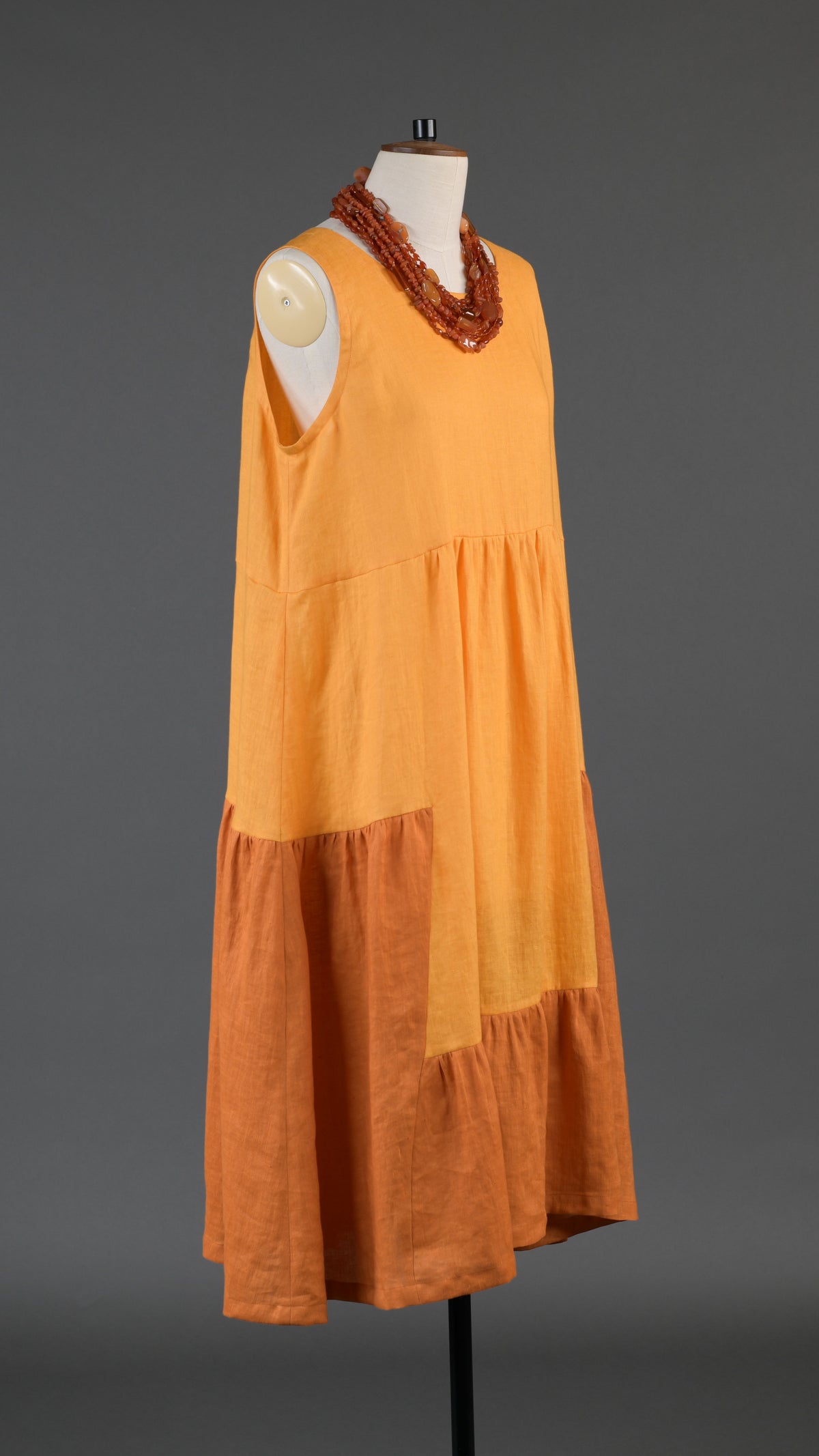 two tone tiered pleated sleeveless dress in orange mix