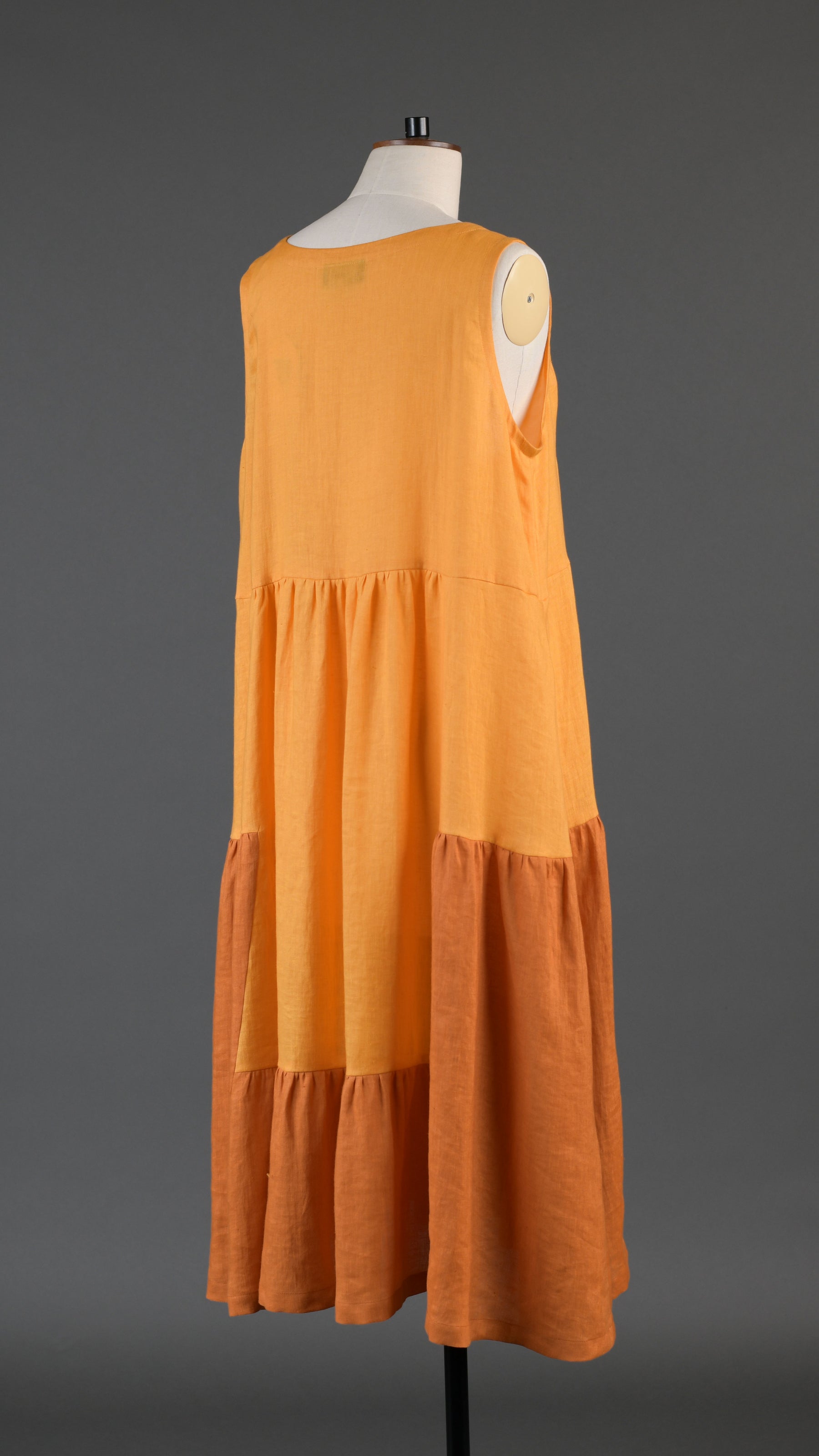 two tone tiered pleated sleeveless dress in orange mix